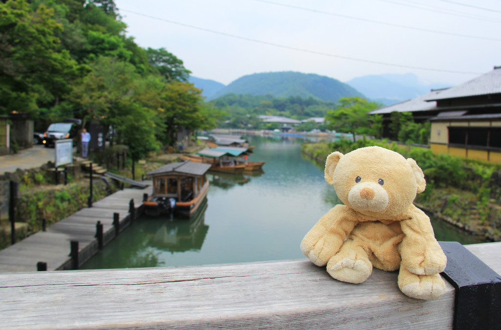 Traditional wooden boats on a river in Kyoto.