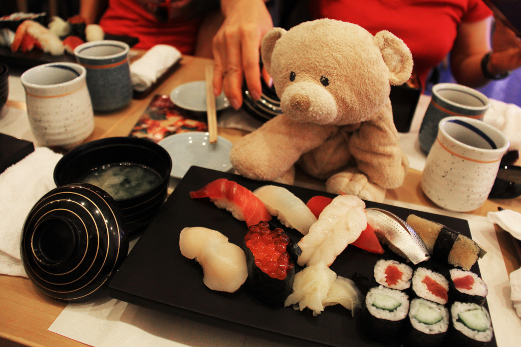 Woody enjoying delicious sushi served with miso soup.