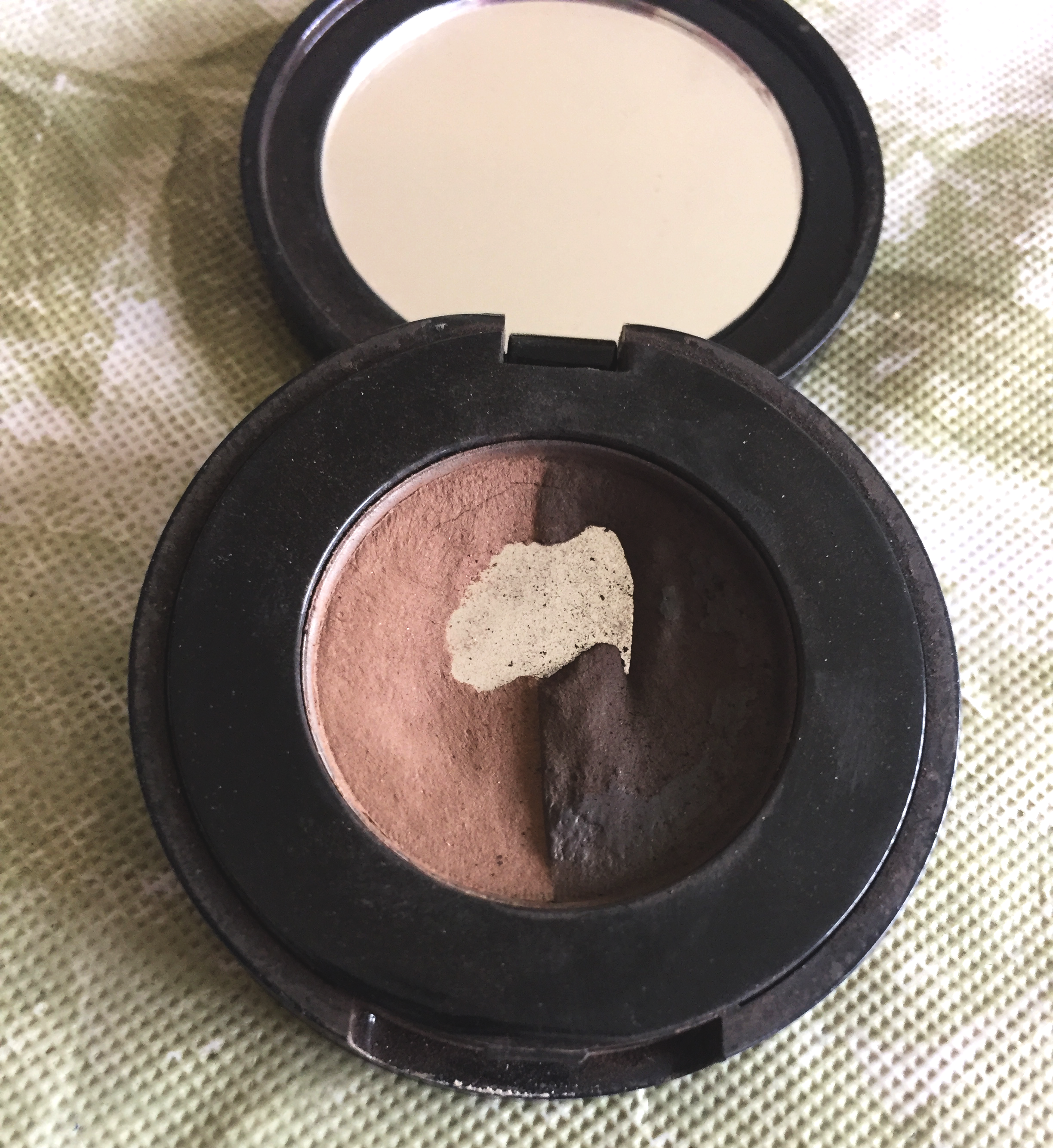 My 4 year old eyebrow powder that I finally hit pan on.