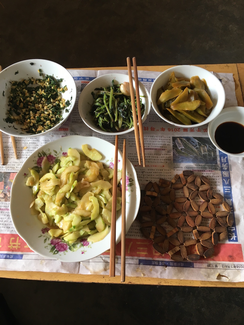 These were the side dishes that went with the porridge. Here we have tofu, string beans, pickled cucumber, and watermelon skin (Listed respectively from top left). 